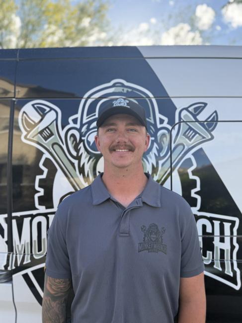 Kris, skilled automotive technician at Monkey Wrench Automotive